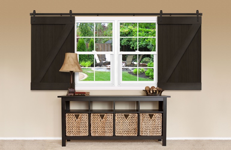 Dark brown Z-frame sliding barn doors on a window 